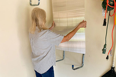 Large window hurricane shutter installation